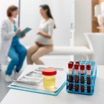 pregnant-woman-consulting-with-doctor-in-hospital-regarding-uti-treatment
