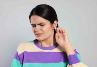 woman-experiencing-ear-pain-with-worried-expression