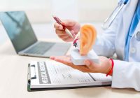 doctor-explains-ear-anatomy-with-model-in-office-Acute-otitis-media